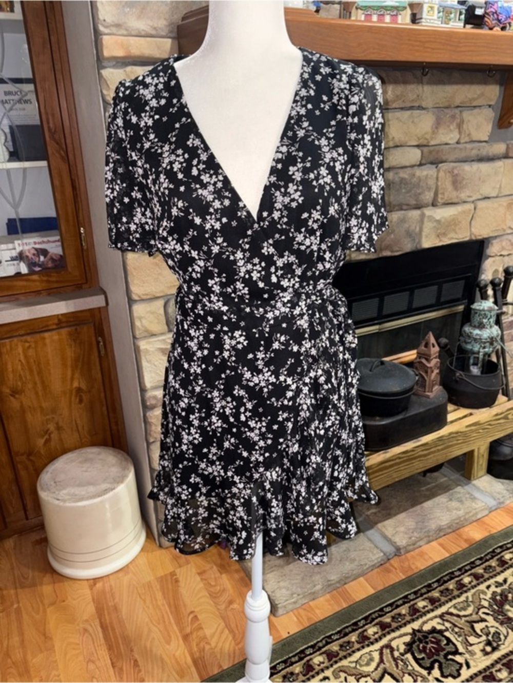 NWT mi ami size medium black with white floral pattern wrap dress.